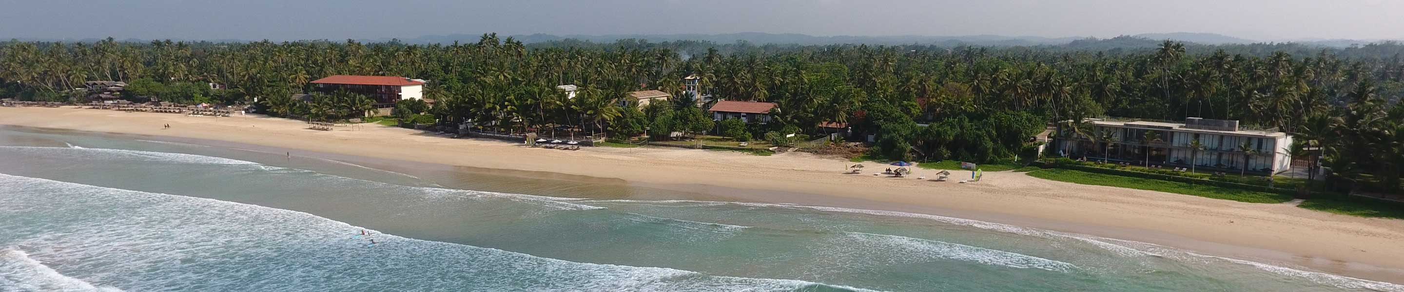 Aerial view of the property accompanied by sandy beaches in summer holidays
