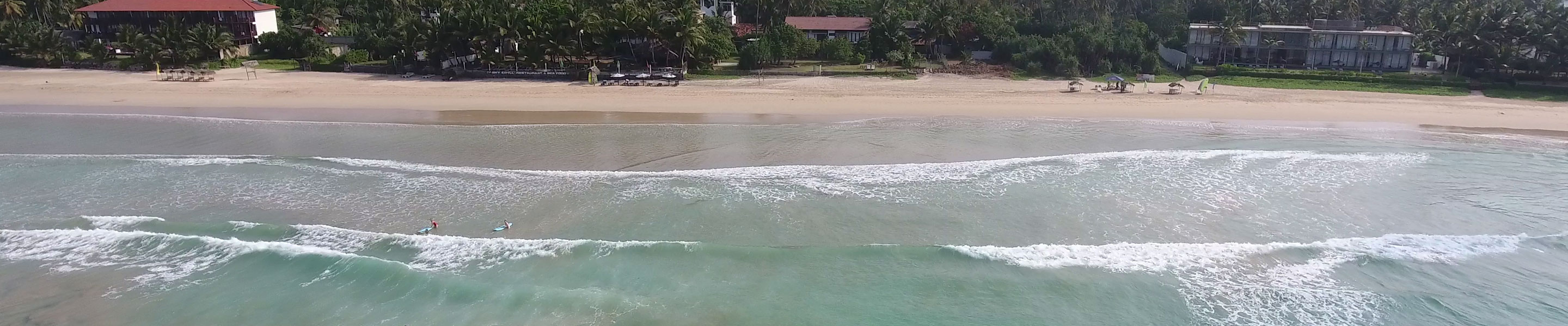 Aerial view of the property accompanied by sandy beaches in summer holidays