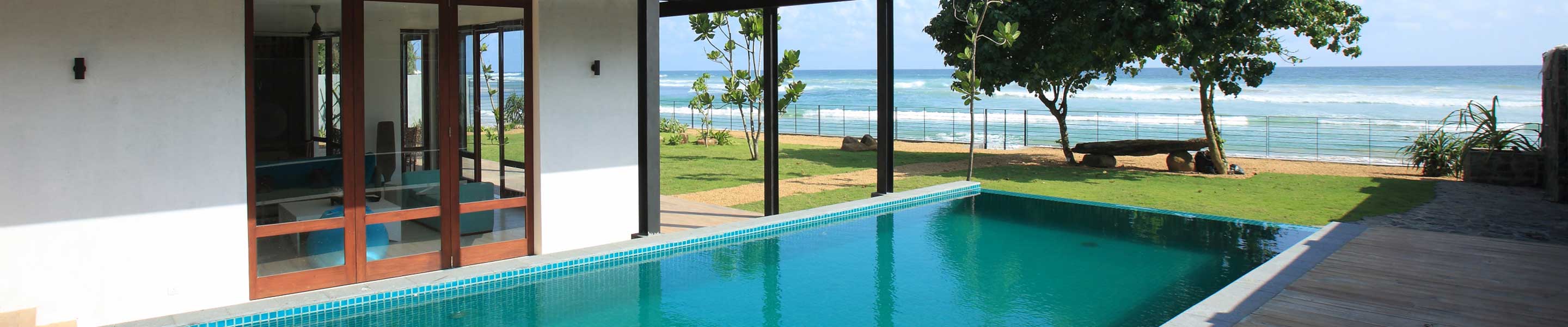 Sea view from the pool and a shady seat under a big tree