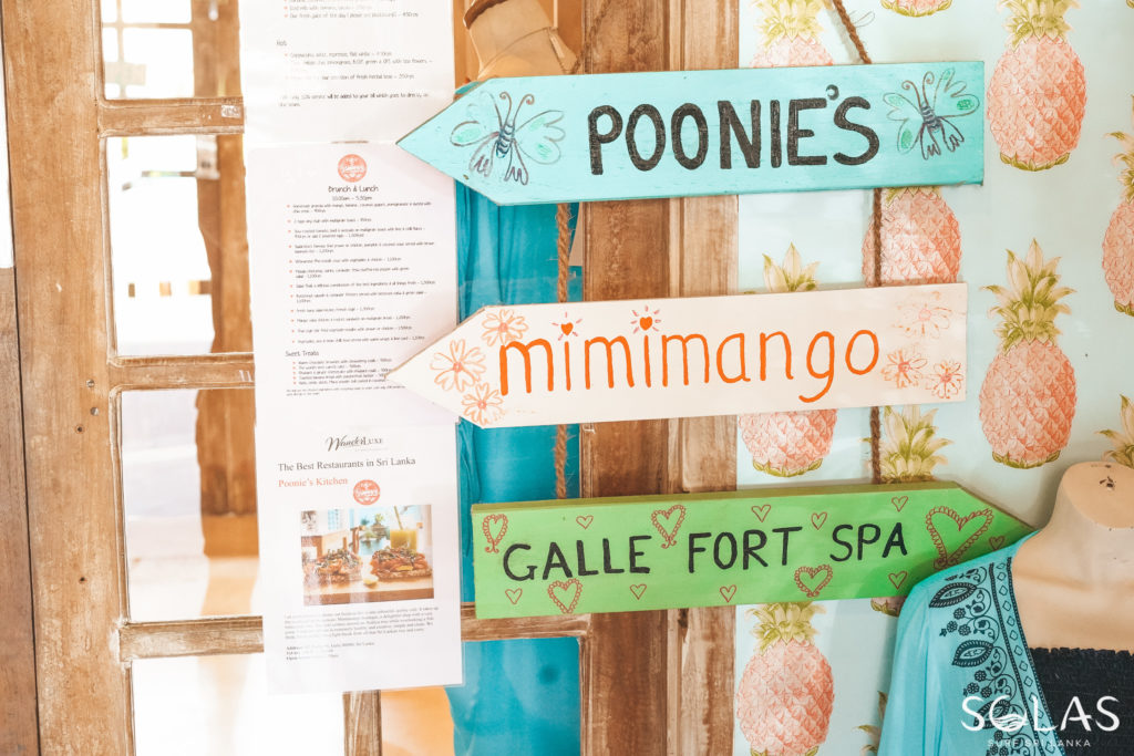 Signs showing where Poonies Kitchen, Mimimango & Galle Fort Spa are in Galle Fort, Sri Lanka