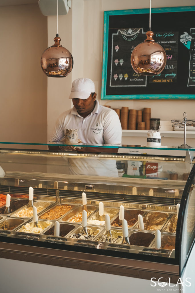 Counter attendant serving gelato at Isle of Gelato in Galle Fort, Sri Lanka