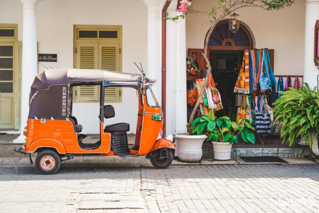 Red Tuk Tuk outside a boutique shop in the streets of Galle Fort, Sri Lanka